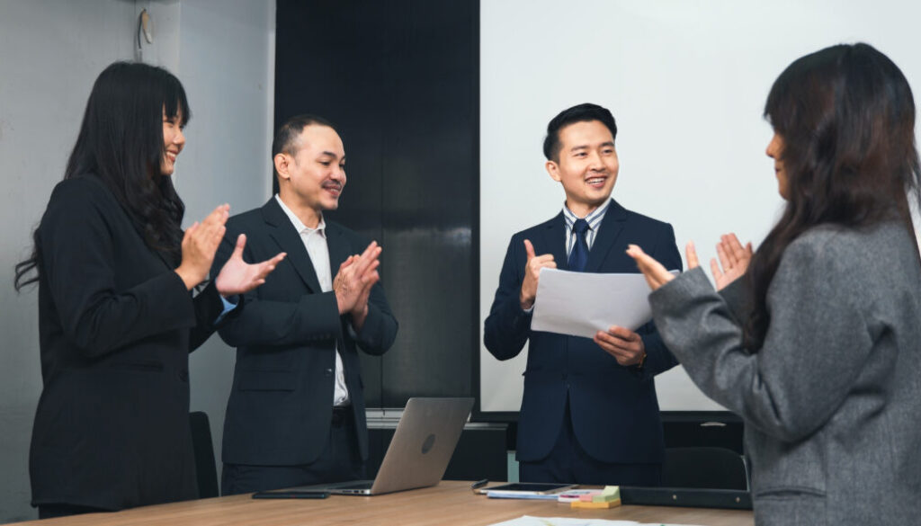 Business people team confident working and communicating together and were clapping applauding