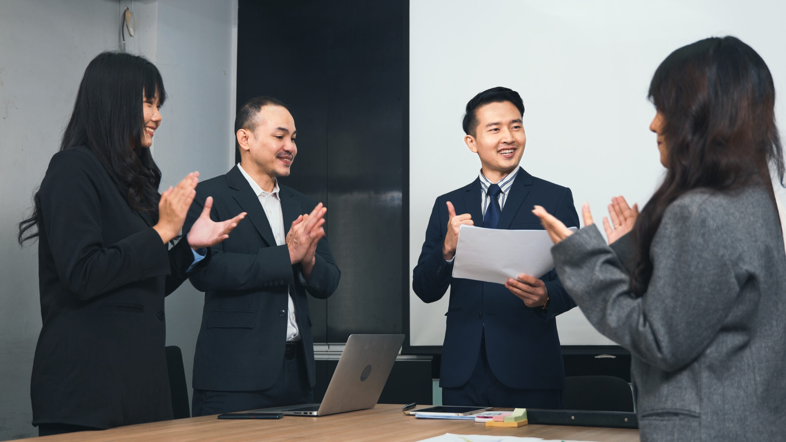 Business people team confident working and communicating together and were clapping applauding